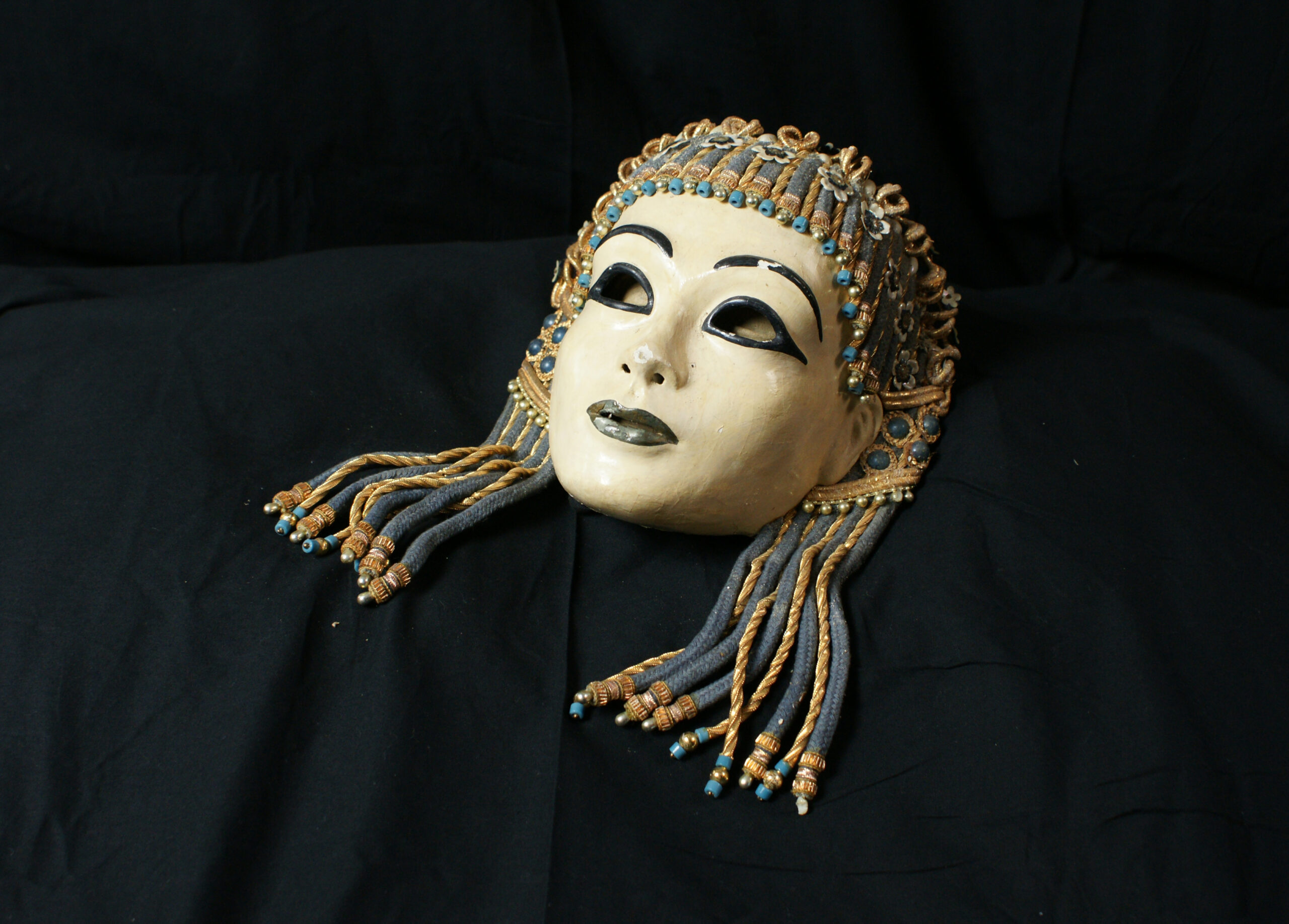 a headdress by Oliver Messel, fashioned from twisted wire pendants and painted paper worn by Vivien Leigh in George Cukor’s 1946 ration-stricken film of Caesar and Cleopatra.