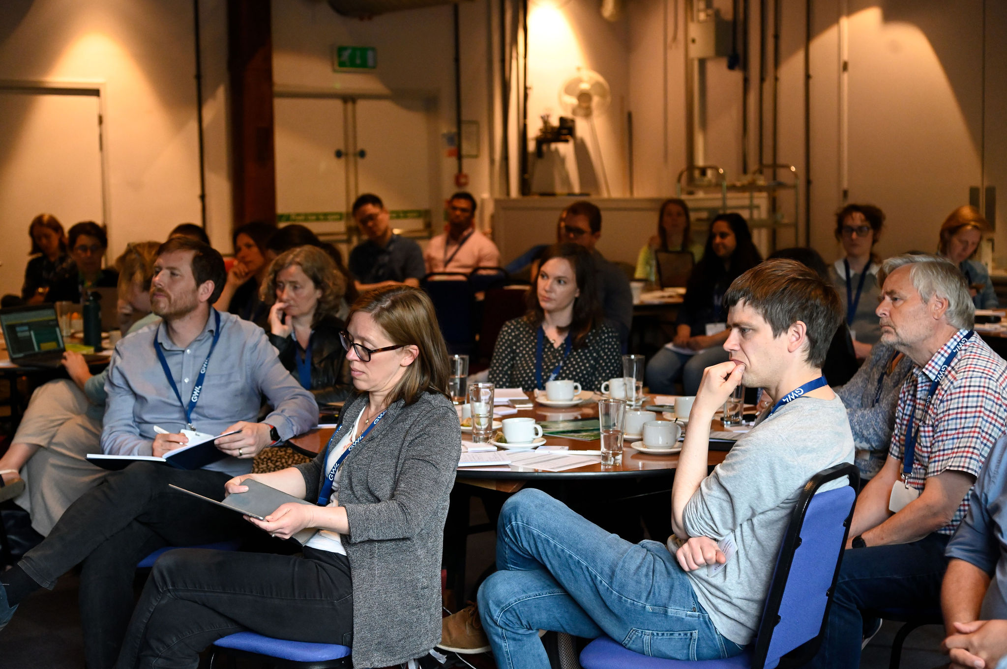 Attendees listen to panel discussion